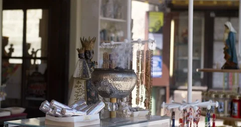 Religious objects for sale and incense burning at Altötting, Germany Stock Footage 113913352