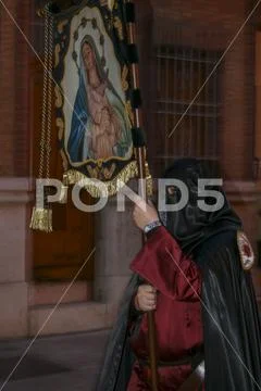 Religious people walking in procession for the Holy Week Semana Santa in Spa Stock Photos