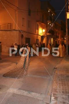Religious people walking in procession for the Holy Week Semana Santa in Spa Stock Photos