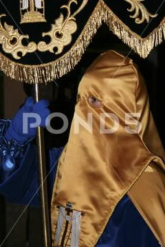 Religious people walking in procession for the Holy Week Semana Santa in Spa Stock Photos