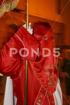 Religious people walking in procession for the Holy Week Semana Santa in Spa Stock Photos