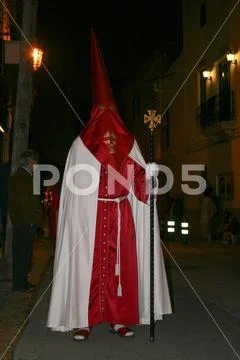 Religious people walking in procession for the Holy Week Semana Santa in Spa Stock Photos