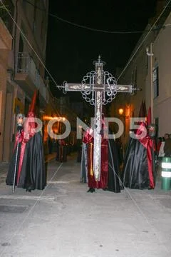 Religious people walking in procession for the Holy Week Semana Santa in Spa Stock Photos