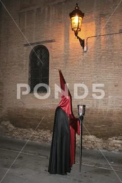 Religious people walking in procession for the Holy Week Semana Santa in Spa Stock Photos