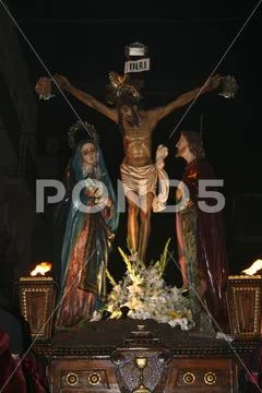 Religious people walking in procession for the Holy Week Semana Santa in Spa Stock Photos