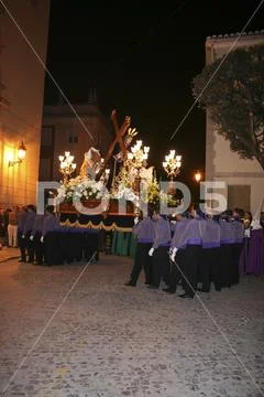 Religious people walking in procession for the Holy Week Semana Santa in Spa Stock Photos