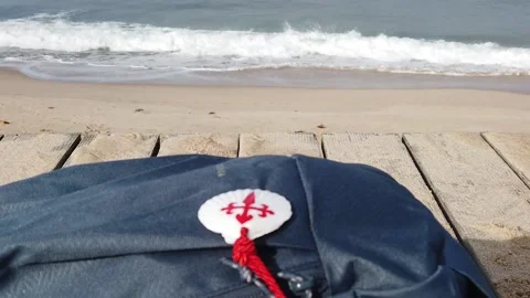 Religious Pilgrim Backpack Resting on the Beach Video stock 220876108