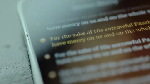 Religious prayer asking for mercy displayed on mobile phone screen Stock Footage 326943547