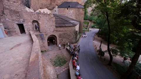 Religious procession arriving at Royal Monastery of San Juan de la Peña, Stock Footage 98159215