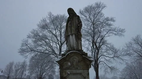 RELIGIOUS STATUE IN HARD SNOW Stock Footage 187693739