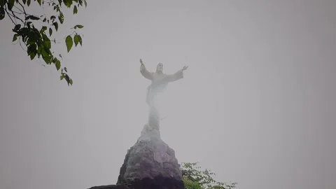 Religious statue with light behind it - slow motion Stock Footage 146051891