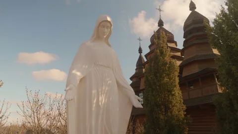 Religious statue at midday, Historical object, fragile wooden building Stock Footage 229774122