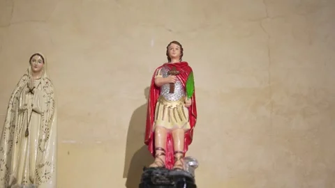 Religious Statues Against Plain Wall Stock Footage 312749564