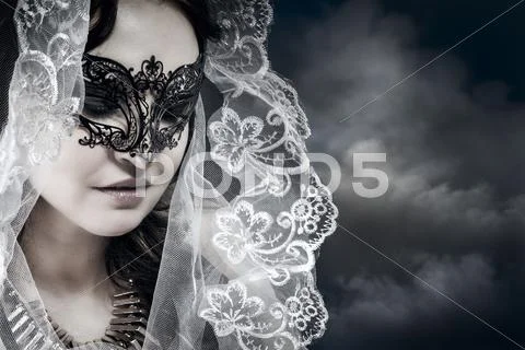 Religious woman with white veil in a position to pray Stock Photos