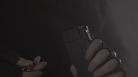 Reloading ammunition. Dark background. Bullets. Stock Footage 199566583