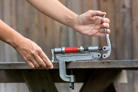 Reloading cartridge by shotgun shell reloader, closeup Stock Photos