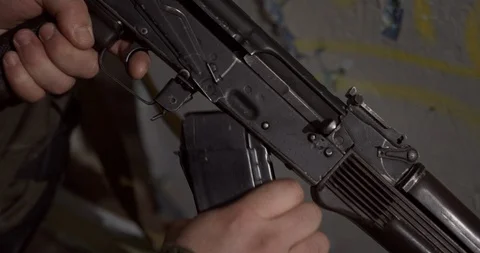 Reloading a handgun Stock Footage 129556479