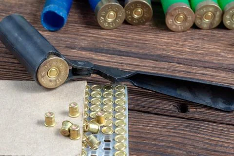 Reloading process shotgun shells with special reload equipment. Powder, bulle Stock Photos