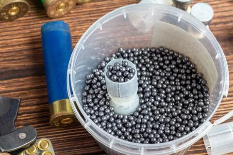 Reloading process shotgun shells with special reload equipment. Powder, bulle Stock Photos