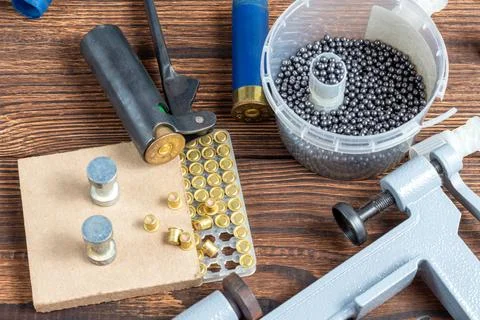 Reloading process shotgun shells with special reload equipment. Powder, bulle Stock Photos