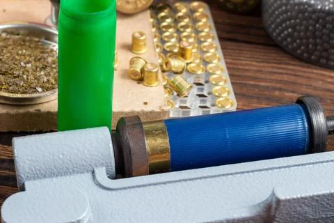Reloading process shotgun shells with special reload equipment. Powder, bulle Stock Photos