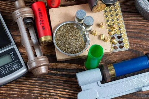 Reloading process shotgun shells with special reload equipment. Powder, bulle Stock Photos