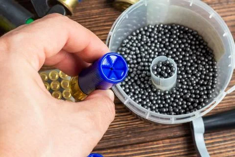 Reloading process shotgun shells with special reload equipment. Powder, bulle Stock Photos