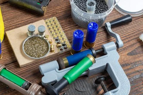 Reloading process shotgun shells with special reload equipment. Powder, bulle Stock Photos