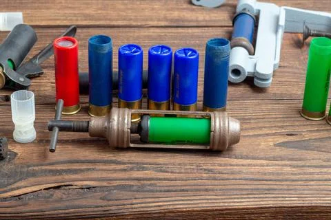 Reloading process shotgun shells with special reload equipment. Powder, bulle Stock Photos