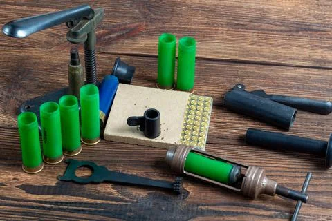 Reloading process shotgun shells with special reload equipment. Powder, bulle Stock Photos