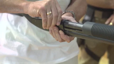 Reloading a shotgun at a shooting range by a man Stock Footage 82618323