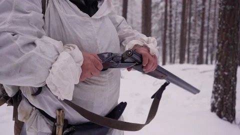 Reloading weapons on winter hunt. Barreled gun opened in the hands of a hunter. Stock Footage 150865379
