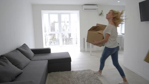 Relocation to new home, happy pair bring boxes and relish buying new apartment Video stock 106181052