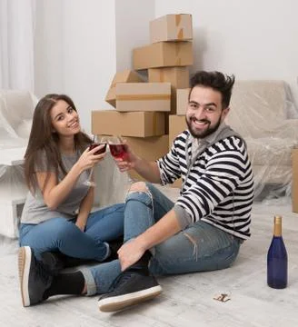 Relocation is time for joy and happiness. Couple celebrating relocation to new Stock Photos
