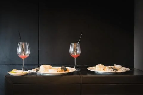 Remaining meal on black table Fotos Stock