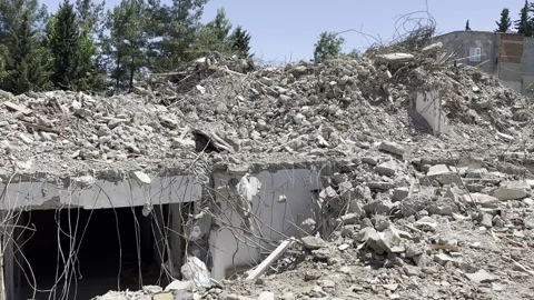 The remaining wreckage of a collapsed house Stock Footage 245349585