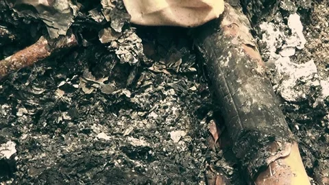 The remains after burning, everything was burnt, leaving only charcoal and ash Stock Footage 305041503