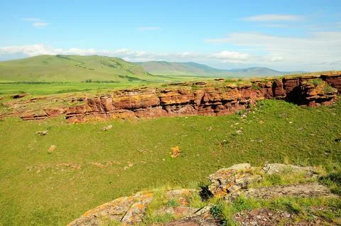 The remains of an ancient stone structure walking along the top of a high a.. Stock Photos