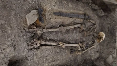 The remains of an ancient warrior discovered during archaeological excavations,  Stock Footage 294787322