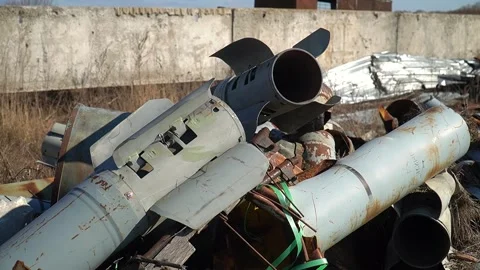 Remains of exploded ammunition, shells of multiple launch rocket systems Stock Footage 313365044