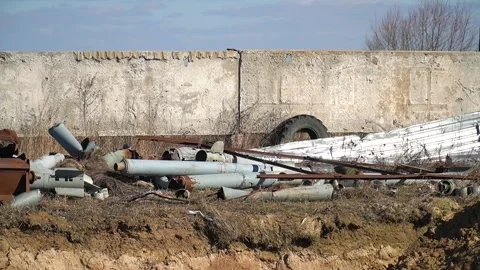 Remains of exploded ammunition, shells of multiple launch rocket systems Stock Footage 313365076