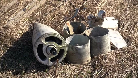 Remains of exploded ammunition, shells of multiple launch rocket systems Stock Footage 313365094
