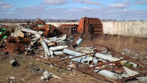 Remains of exploded ammunition, shells of multiple launch rocket systems Stock Footage 313365114