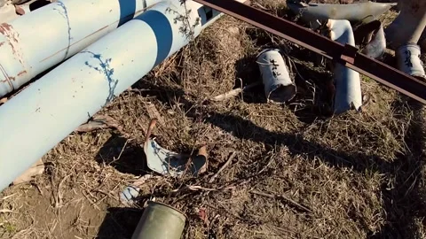 Remains of exploded ammunition, shells of multiple launch rocket systems Stock Footage 313365149