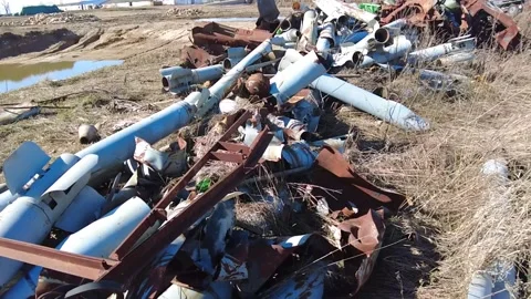 Remains of exploded ammunition, shells of multiple launch rocket systems Stock Footage 313365172