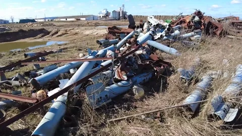 Remains of exploded ammunition, shells of multiple launch rocket systems Stock Footage 313365181