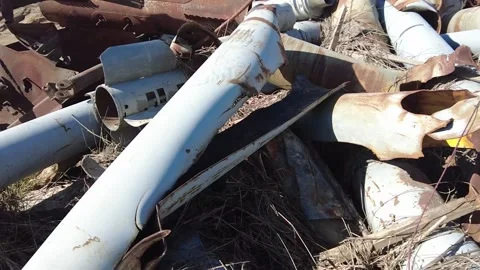 Remains of exploded ammunition, shells of multiple launch rocket systems Stock Footage 313365182