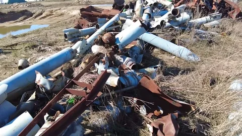 Remains of exploded ammunition, shells of multiple launch rocket systems Stock Footage 313365186