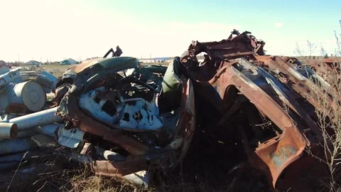 Remains of exploded ammunition, shells of multiple launch rocket systems Stock Footage 313365194