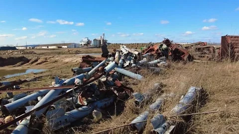 Remains of exploded ammunition, shells of multiple launch rocket systems Stock Footage 313365197